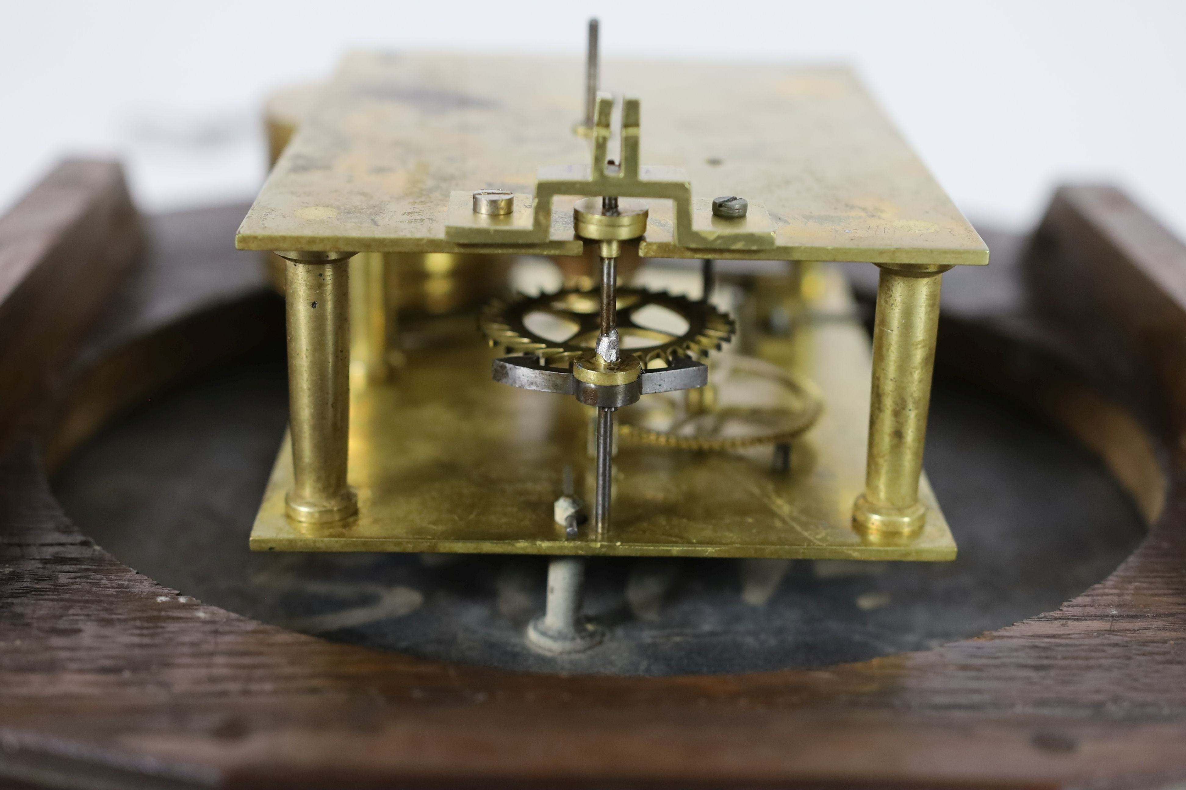 E. White, 20 Cockspur Street, London. A late Victorian oak cased wall timepiece, diameter 38cm